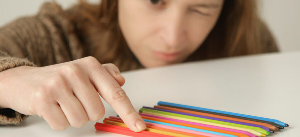 An accountant lining up their coloured pens perfectly because they care so much about things being right